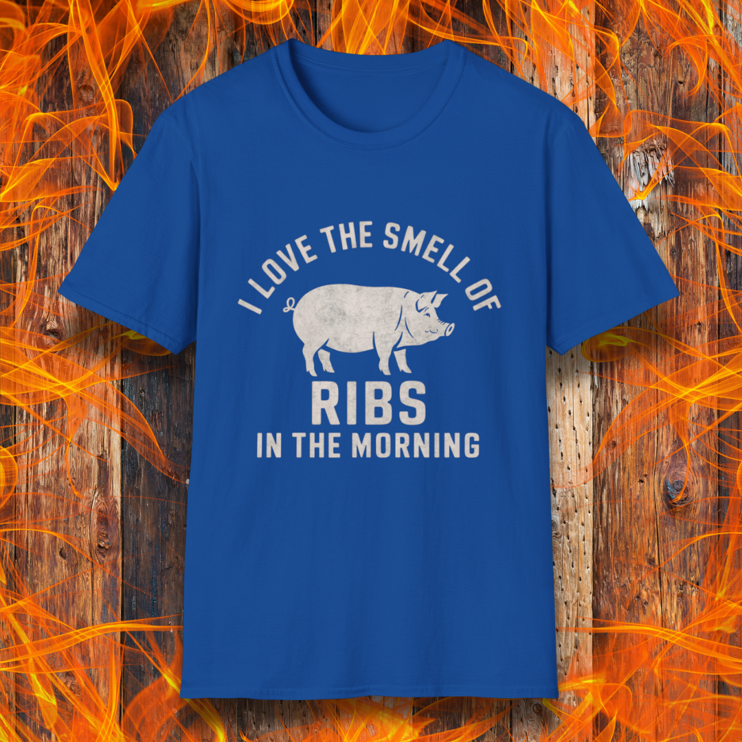 Royal Blue T-shirt featuring a vintage-style design with the phrase 'I Love the Smell of Ribs in the Morning' and a rustic, hand-drawn pig illustration. Perfect for BBQ pitmasters and rib lovers!