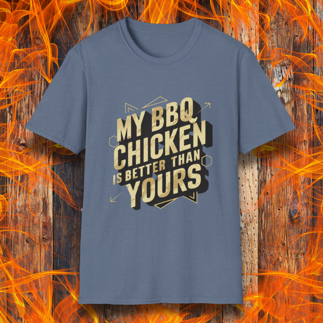 Heather Indigo T-shirt featuring a bold BBQ-themed design that reads 'MY BBQ CHICKEN IS BETTER THAN YOURS' in gold and black block lettering with geometric accents. A great choice for grill masters who take pride in their perfectly smoked and seasoned chicken.