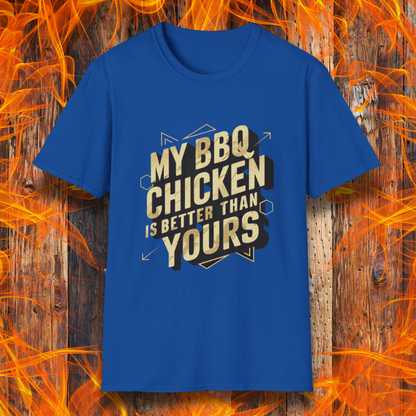 Royal Blue T-shirt featuring a bold BBQ-themed design that reads 'MY BBQ CHICKEN IS BETTER THAN YOURS' in gold and black block lettering with geometric accents. A great choice for grill masters who take pride in their perfectly smoked and seasoned chicken.