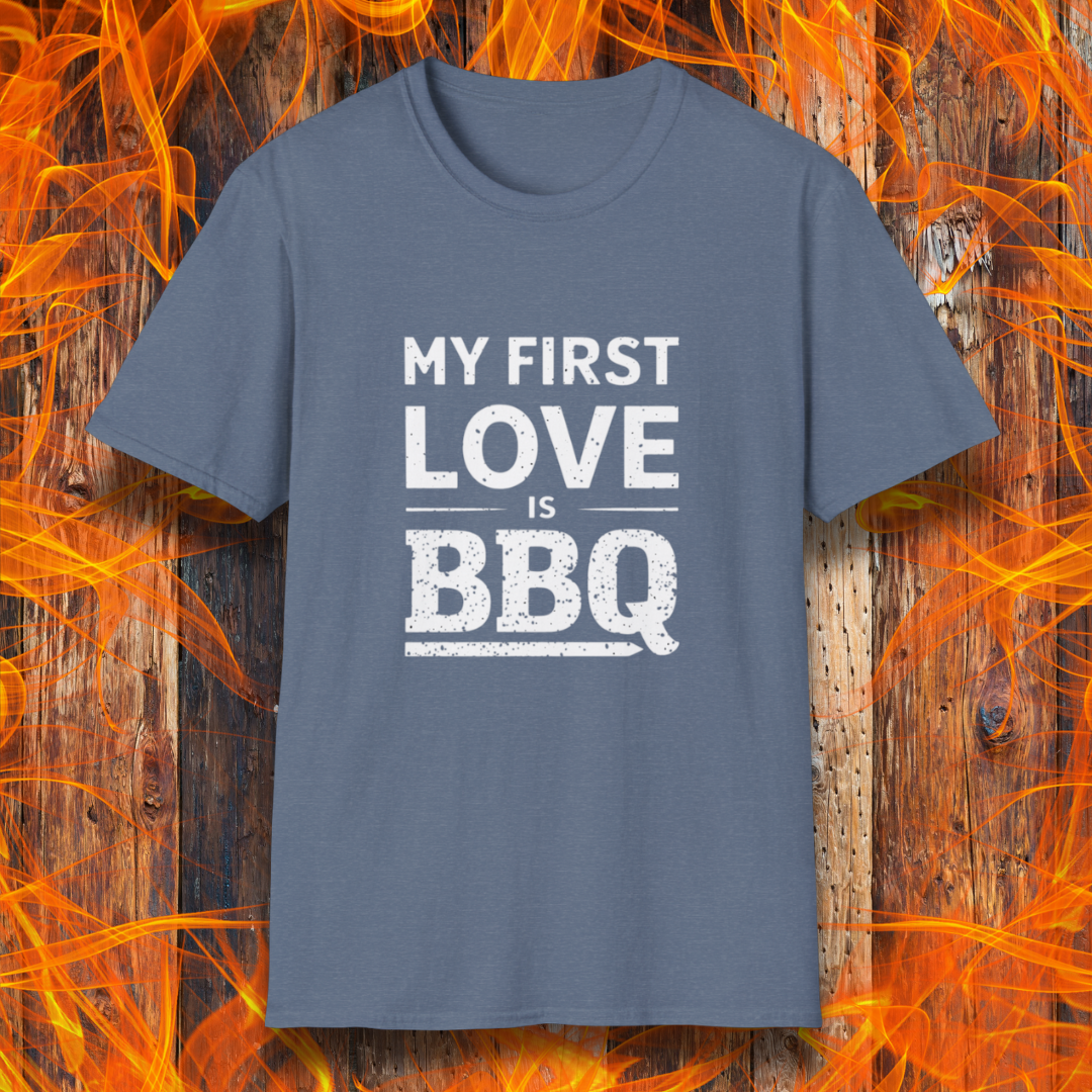 Heather Indigo T-shirt with 'My First Love Is BBQ' in bold, distressed white lettering. A must-have for BBQ enthusiasts who wear their passion on their sleeve—literally!