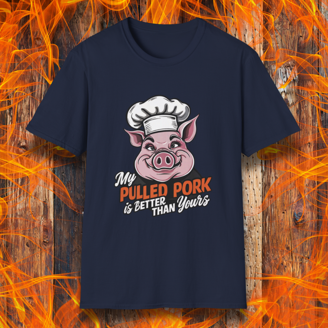Navy T-shirt featuring a fun BBQ-themed design with a pink cartoon pig wearing a chef’s hat. The bold text reads 'My Pulled Pork is Better Than Yours' in a mix of white and red script and block lettering. Perfect for pitmasters who take pride in their slow-cooked pulled pork."