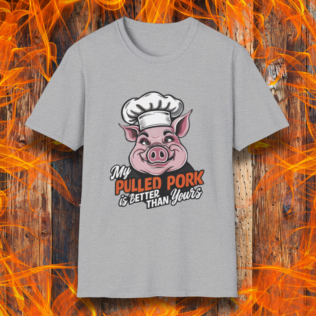 Sport Grey T-shirt featuring a fun BBQ-themed design with a pink cartoon pig wearing a chef’s hat. The bold text reads 'My Pulled Pork is Better Than Yours' in a mix of white and red script and block lettering. Perfect for pitmasters who take pride in their slow-cooked pulled pork."