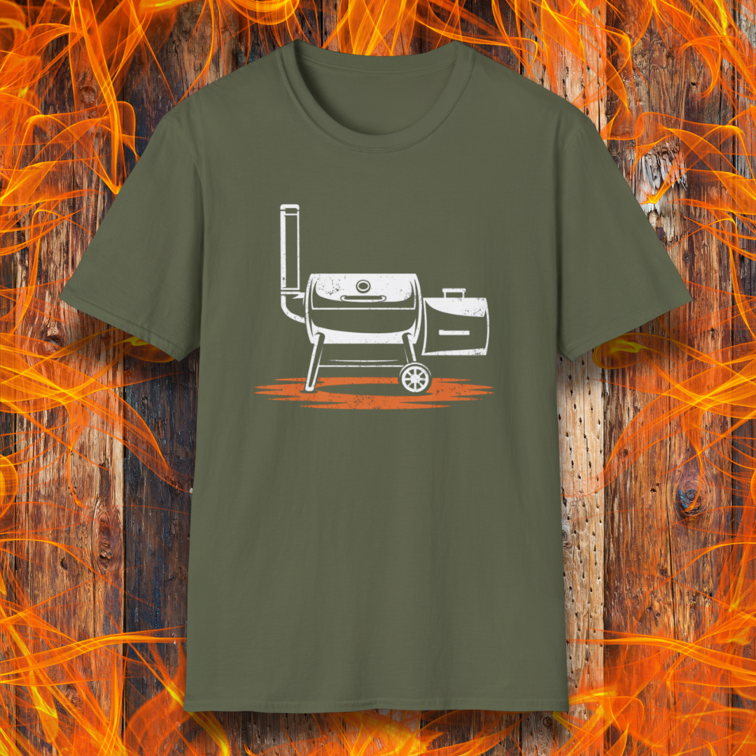 Green t-shirt with a white grill graphic on a wooden background with flames.