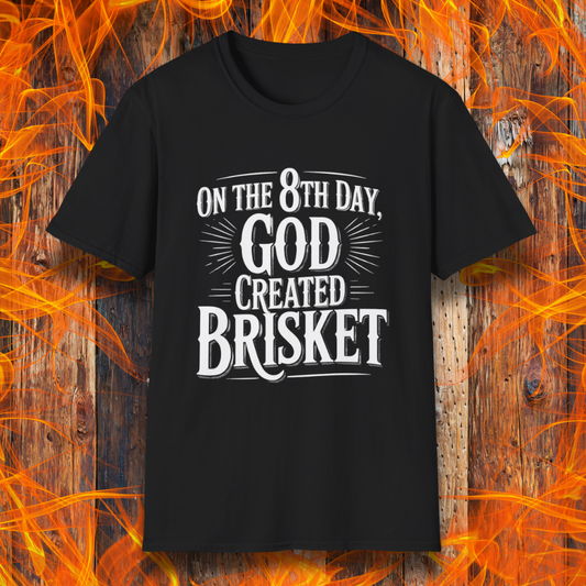 Black t-shirt with bold white lettering that declares “On the 8th Day, God Created Brisket.” A divine pick for pitmasters who treat smoked meat like gospel.