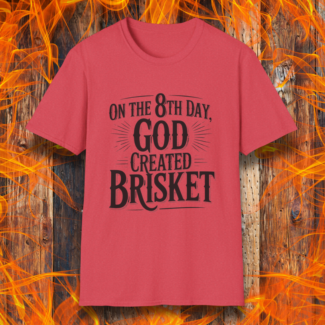 Heather Red t-shirt with bold black lettering that declares “On the 8th Day, God Created Brisket.” A divine pick for pitmasters who treat smoked meat like gospel.