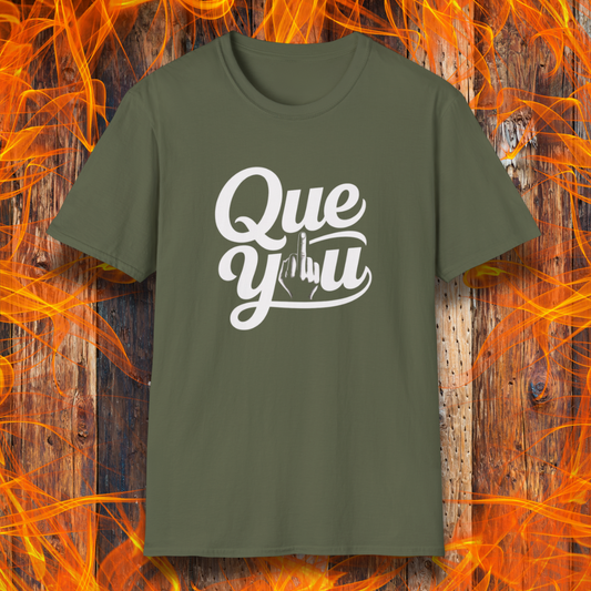 Green t-shirt with 'Que y u' text on a wooden background with flames