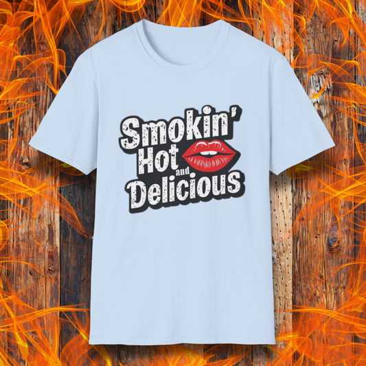 Light Blue t-shirt featuring bold white text that reads 'Smokin' Hot and Delicious,' with a red lips graphic replacing the 'o' in 'Hot' for a fun, flirty BBQ-inspired design