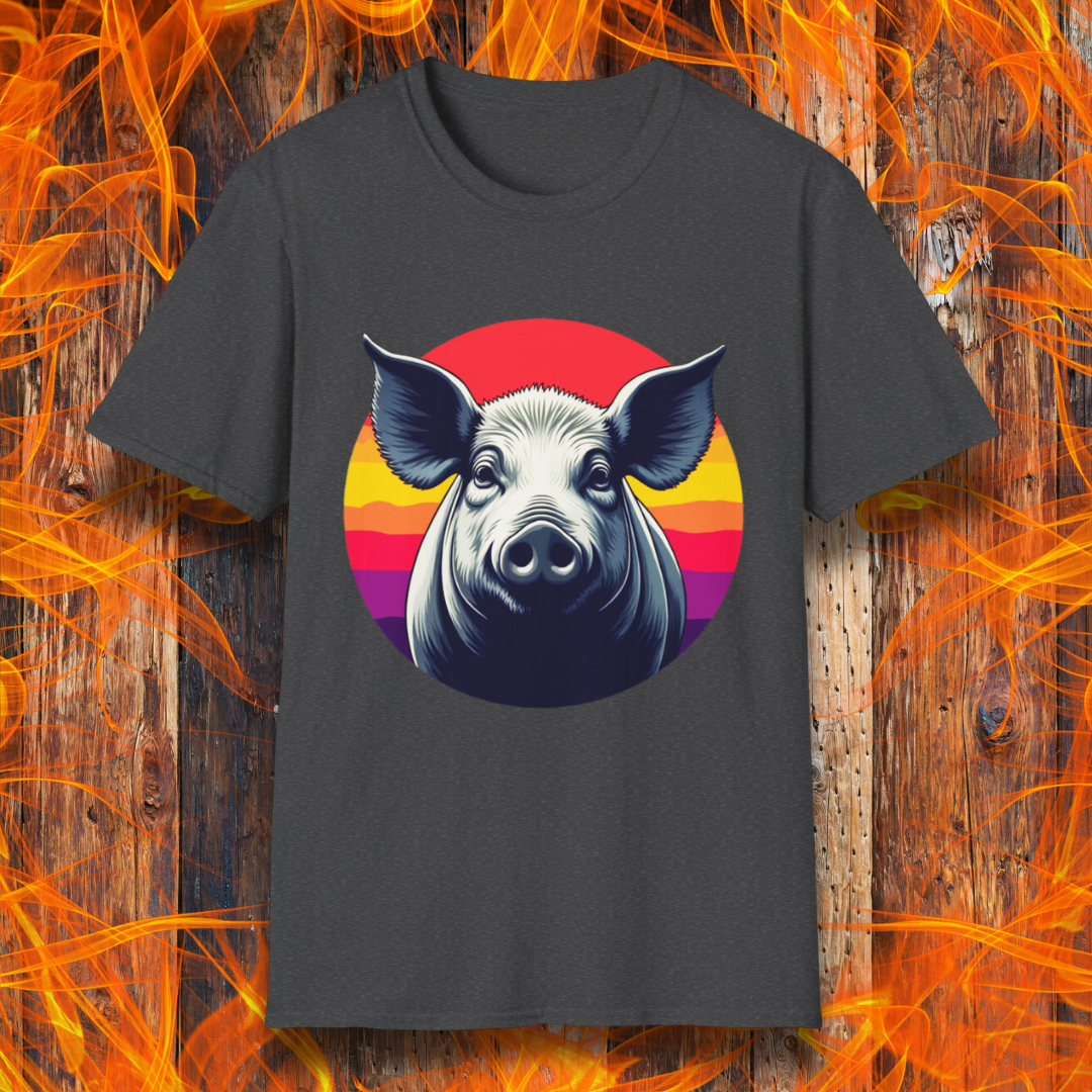 Dark Heather T-shirt featuring a striking illustration of a pig's face in a bold, high-contrast style, set against a circular sunset background with vibrant red, orange, and purple hues. The design gives a rustic yet modern feel, making it an excellent choice for BBQ lovers.