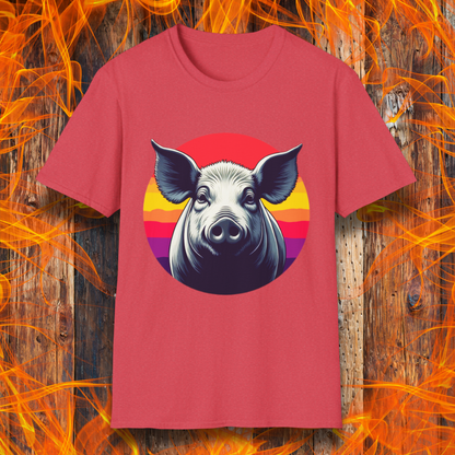 Heather Red T-shirt featuring a striking illustration of a pig's face in a bold, high-contrast style, set against a circular sunset background with vibrant red, orange, and purple hues. The design gives a rustic yet modern feel, making it an excellent choice for BBQ lovers.