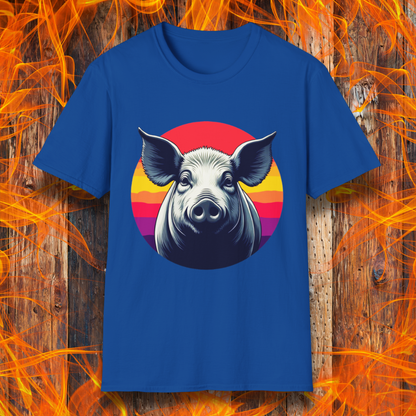 Royal Blue T-shirt featuring a striking illustration of a pig's face in a bold, high-contrast style, set against a circular sunset background with vibrant red, orange, and purple hues. The design gives a rustic yet modern feel, making it an excellent choice for BBQ lovers.