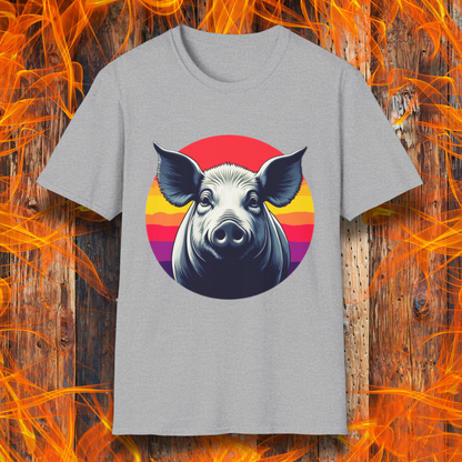 Sport Grey T-shirt featuring a striking illustration of a pig's face in a bold, high-contrast style, set against a circular sunset background with vibrant red, orange, and purple hues. The design gives a rustic yet modern feel, making it an excellent choice for BBQ lovers.