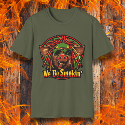 Military Green T-shirt featuring a cool, reggae-inspired pig with dreadlocks, sunglasses, and a cigar, with the phrase 'We Be Smokin’' in bold, fiery lettering. A must-have for BBQ lovers who like to keep it chill while grilling!