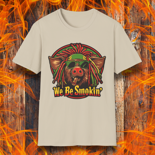 Sand T-shirt featuring a cool, reggae-inspired pig with dreadlocks, sunglasses, and a cigar, with the phrase 'We Be Smokin’' in bold, fiery lettering. A must-have for BBQ lovers who like to keep it chill while grilling!