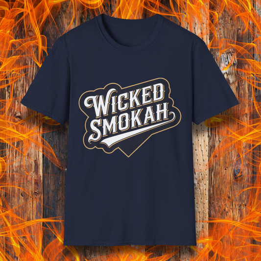 Navy T-shirt featuring a bold, vintage-style design that reads "Wicked Smokah" in stylized typography, resembling a sports team logo. The lettering has a mix of white and gold outlines, giving it a classic and rugged look. The shirt is displayed against a fiery wooden background, reinforcing the smoky BBQ theme.